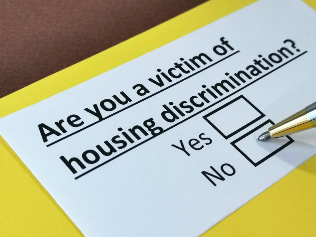 Condo owner filling out a questionnaire regarding housing discrimination.